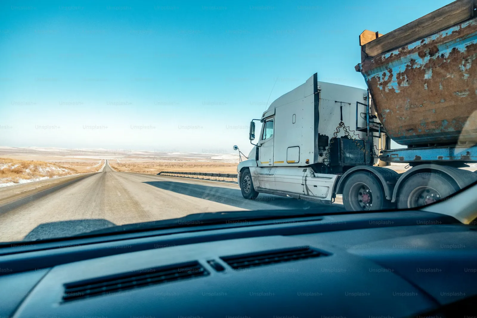 A commercial vehicle on an open highway, representing mobility tracking and operations.